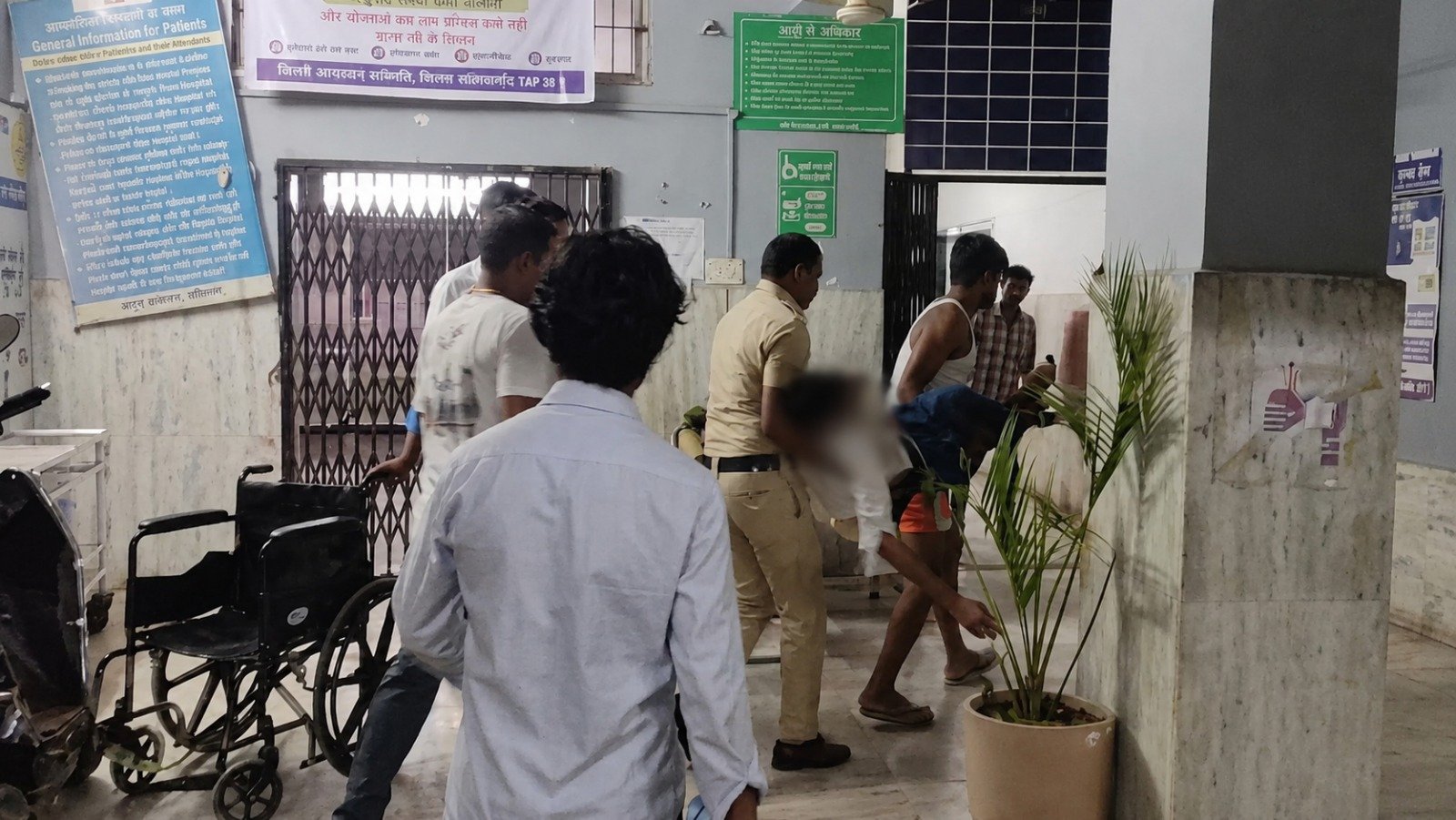 Police team taking the young man to the hospital