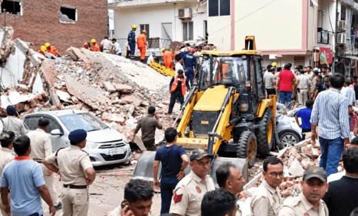 Debris of the collapsed five-storey PG building