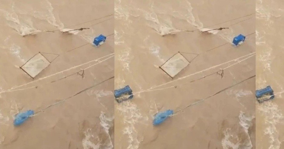 Liquor bottles floating in floodwaters  (Image Source: Social Media)